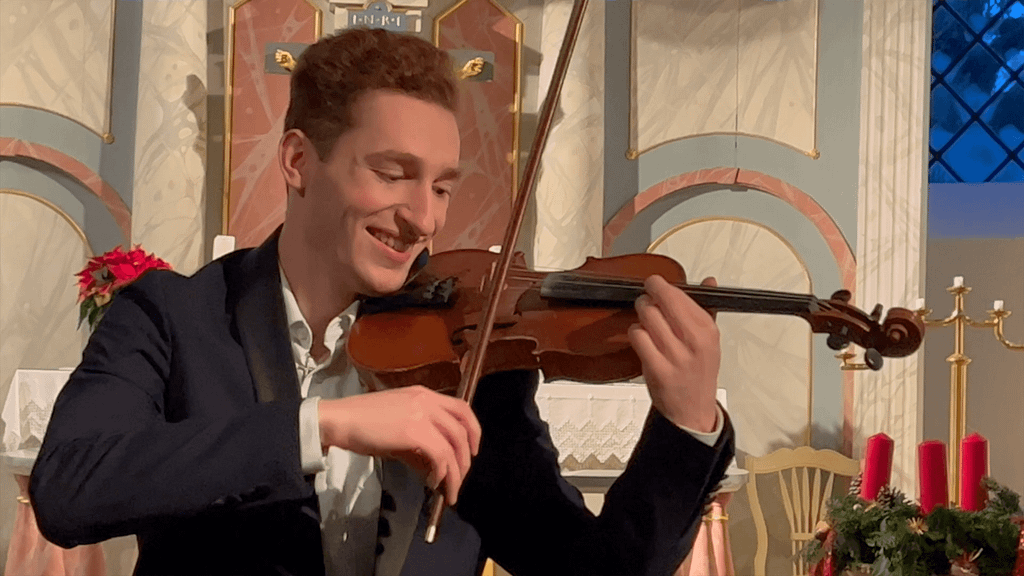 Violinist Paul Kolodziej (Musician) at a live performance of his Christmas Album Believe in the Church of Curau playing "God Bless Us Everyone" during the concert